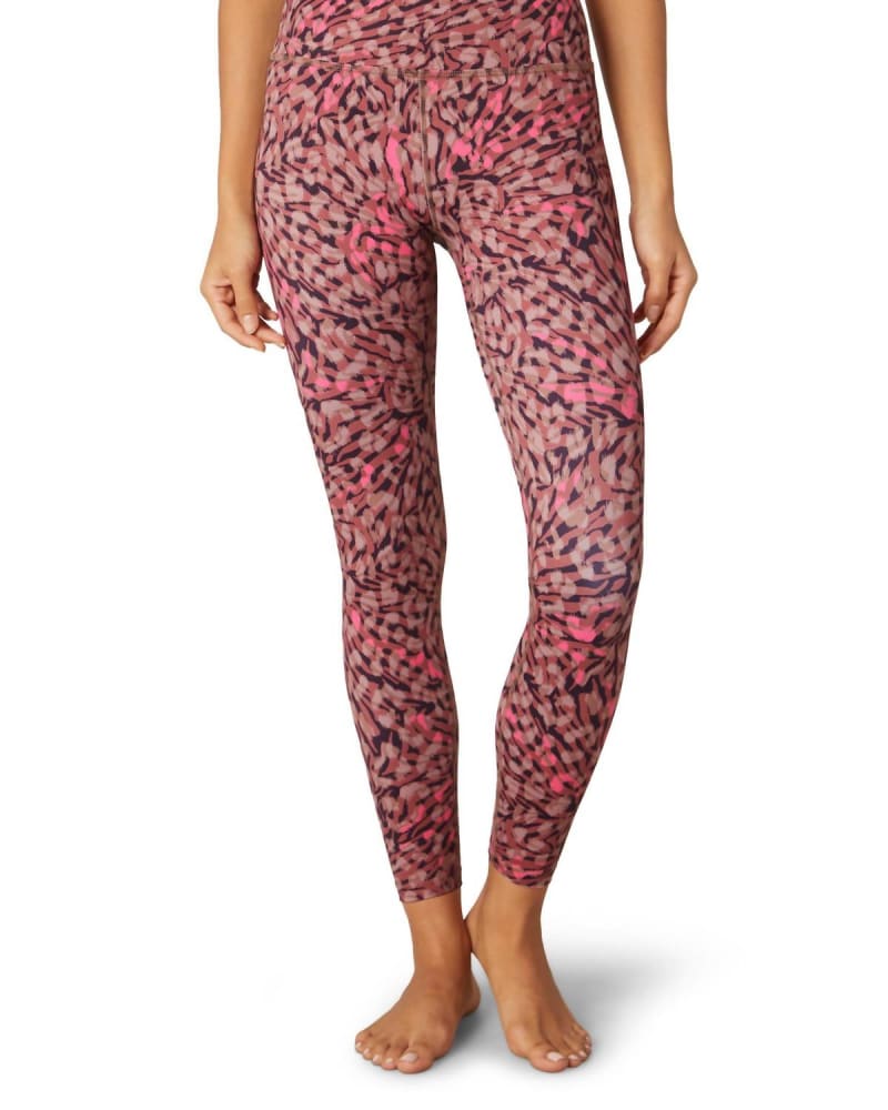 Front of a model wearing a size L Lux High Waisted Midi Leggings in Electric Cheetah Swirl in Electric Cheetah Swirl by Beyond Yoga. | dia_product_style_image_id:346009
